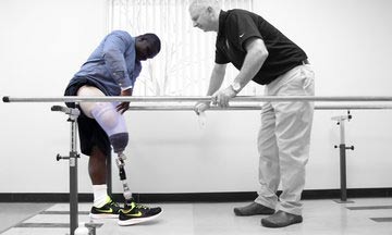 doctor and patient with prosthetic leg