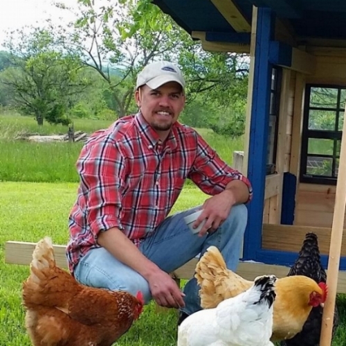 Ben Koch posing with his chickens
